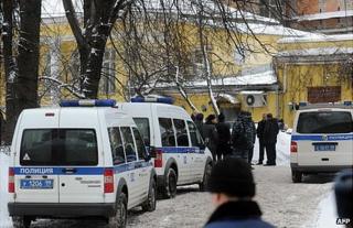 Police cars parked near the spot in Moscow where Aslan Usoyan was shot dead, 16 January