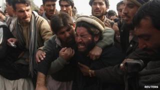 Protesters outside government offices in Peshawar on 16 January 2013