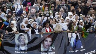 Protesters mourn the bodies of PKK activists arriving at Istanbul airport
