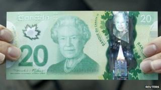 The new Canadian 20 dollar bill made of polymer is displayed at the Bank of Canada in Ottawa 2 May 2012