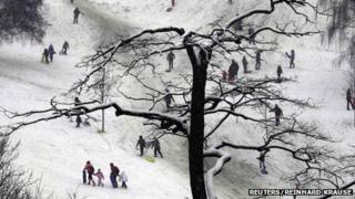 People enjoy the snow at Greenwich Park in London January 20, 2013