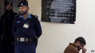 Hamid Munir (right) the brother-in-law of Kamran Faisal, waits at the Supreme Court to submit an application regarding his death