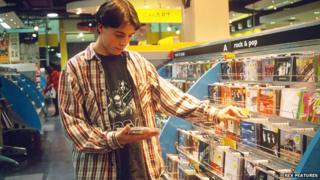 Boy looking at CD