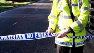 Irish police officer sealing off crime scene