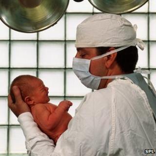 Man holding his new-born baby