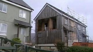 Wind damaged house