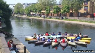 Children from Laburnum Boat Club in kayaks on the canal
