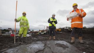 Annwyl Construction team at Croes Atti site, where Roman road slabs have been discovered