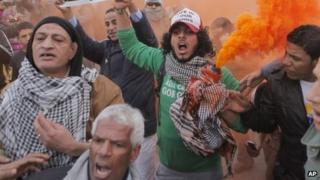 Egyptians shout slogans during anti-President Mohammed Morsi protest in front of the presidential palace in Cairo