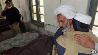 Relatives mourn the deaths of civilians in the attack - 2 February