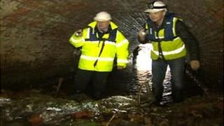 Chris Jackson inside a culvert blocked in recent floods
