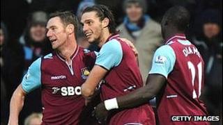 West Ham players celebrate the winner against Swansea in the Premier League