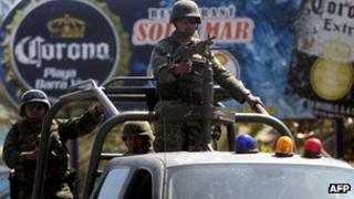 Troops at a checkpoint near the Acapulco house where the Spanish women were raped