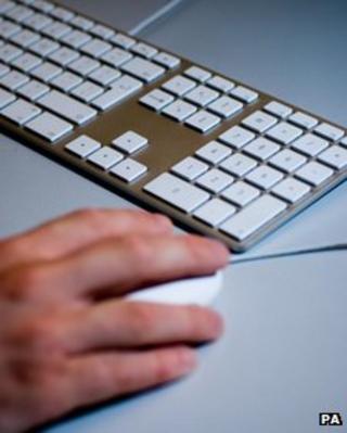 Man typing on keyboard