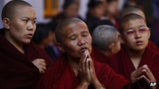 Exiled Tibetan monks praying at a Tibetan Monastery near Boudhanath Stupa, 13 February 2013