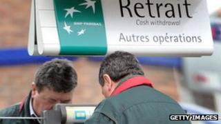 Man withdrawing cash from BNP Paribas