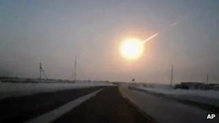 A still from dashboard video recorded in neighbouring Kazakhstan shows the meteor which hit Russia, 15 February