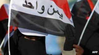 Yemen women hold a flat reading 'Yemen is One' during a demonstration on 11 Feb 2013