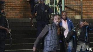 Alleged members of he Union of Nationalists for Renewal outside a court in Pretoria, South Africa - 7 February 2013