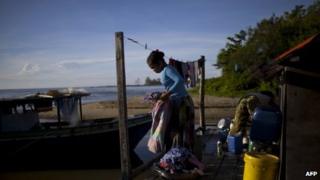 A resident hangs clothes in Tanjung Labian, near the location where the so-called Royal Army of Sulu are holed up, 21 February 2013