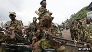 Rebels sit in a truck as they patrol a street in Sake, eastern DR Congo - 21 November 2012
