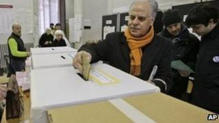 A man casts his ballot in a polling station in central Rome