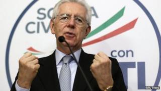 Italian Prime Minister Mario Monti gestures during a news conference in Rome February 25, 2013.