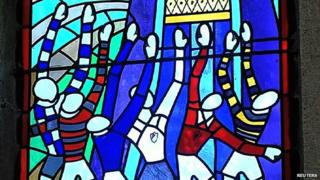 Stained-glass window depicting rugby match in the Chapel of Our Lady of Rugby