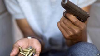 A man with a gun and bullets in South Africa - November 2012