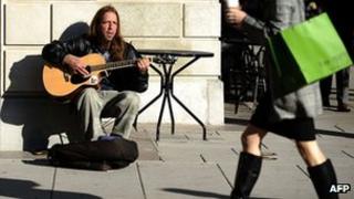 Jobless man busking