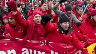 Protesters march outside the venue of the EU summit in Brussels. Photo: 14 March 2013