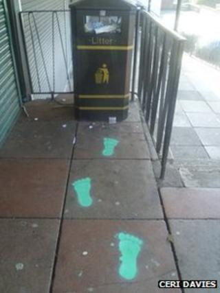 Footprints leading to bin