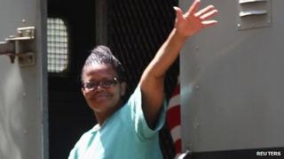Lawyer Beatrice Mtetwa waves as she arrives at Harare Magistrates Court in Zimbabwe on 20 March 2013