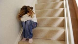 Distressed girl hides her face