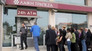 Bank customers at ATM in Nicosia, 21 Mar 13