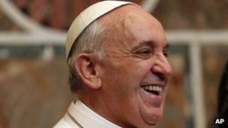 Pope Francis smiles during an audience with ambassadors from the 180 countries that have diplomatic relations with the Holy See, at the Vatican, 22 March 2013