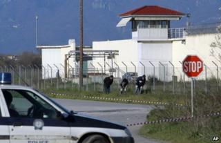 Police search ground outside the prison near Trikala, Greece, 23 March