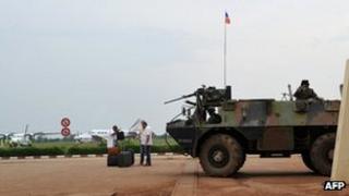 A French armored personnel carrier patrols on March 25, 2013 at Bangui airport.