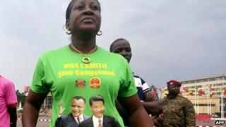 Woman wearing T-shirt of China's Xi Jinping (right) and Congo's Denis Sassou Nguesso in Brazzaville, 29 March 2013