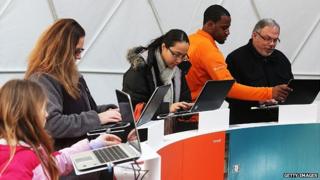 Members of the public try Office 2013 at the product's launch event