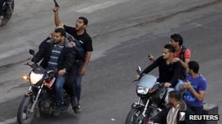 Armed men drag body of suspected collaborator through Gaza's streets. 20 November 2012