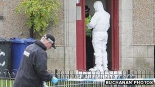 police forensic officer at the scene