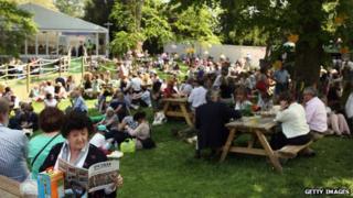 Crowds relax away from the displays at the Chelsea Flower Show