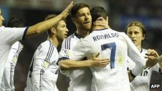 Real Madrid players celebrating after scoring a goal