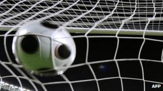 Football in goal netting, file picture