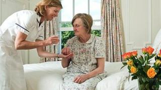 Nurse giving patient medicine