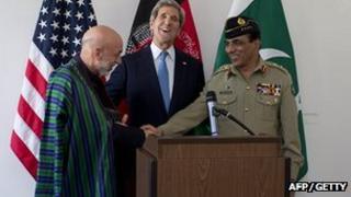 Afghan President Hamid Karzai, US Secretary of State John Kerry and Pakistani military chief General Kayani following talks in Brussels