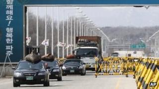 South Korean vehicles, loaded with products in North Korea's Kaesong, cross Unification Bridge after returning from Kaesong, near border village of Panmunjom in Paju, South Korea, 13 April 2013