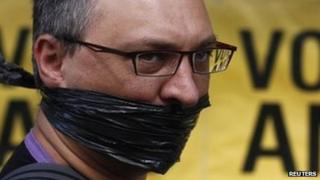 A protester looks on outside the ruling African National Congress (ANC) headquarters, during a protest against the passing of new laws on state secrets in Johannesburg, 22 November 2011.
