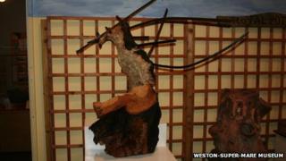 An oak tree speared by iron railings during a WWII bomb explosion
